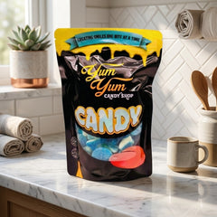 Yum Yum Candy Shop bag on a kitchen counter with a window and decor in the background