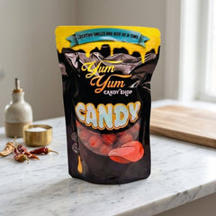 Yum Yum Candy Shop candy bag on a marble surface with a neutral background