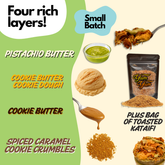 Product packaging with layers of pistachio butter, cookie butter, cookie dough, spiced caramel cookie crumbles, and toasted kataifi.