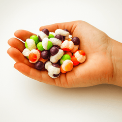 A hand full of yum yum candy shop freeze dried itty bitties