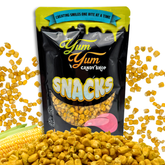 Yum Yum Snacks packaging with corn kernels around on a white background