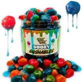 Jar of colorful Gooey Gushables candy with a Yum Yum label on a white background.