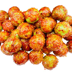Chamoy watermelon sours in bag with watermelon and lime background – sweet and tangy coated candy