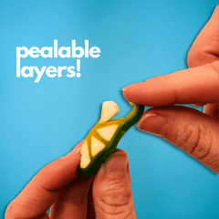 Person peeling a candy lime against a blue background with 'pealable layers!' text.