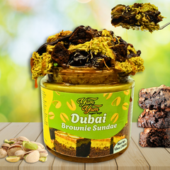 Jar of 'Dubai Brownie Sundae' with a green label on a wooden surface.