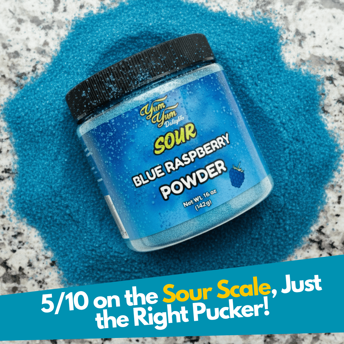 Jar of sour blue raspberry candy powder on a granite countertop surrounded by blue sour powder