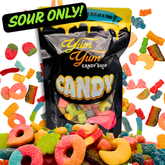 Sour Only gummy candy mix in black Yum Yum Candy Shop bag with colorful sour gummies scattered around