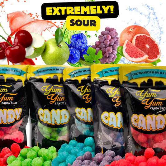 Bags of Yum Yum Candy Shop’s Extreme Sour Balls in assorted colors and flavors, surrounded by fruit like cherries, green apples, grapes, and grapefruit, with the text “Extremely Sour” above them.