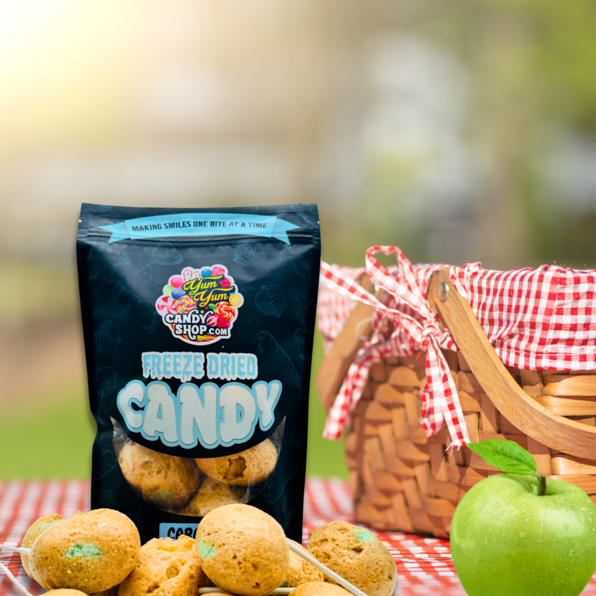 Freeze dried caramel apple pops with green apples at picnic scene