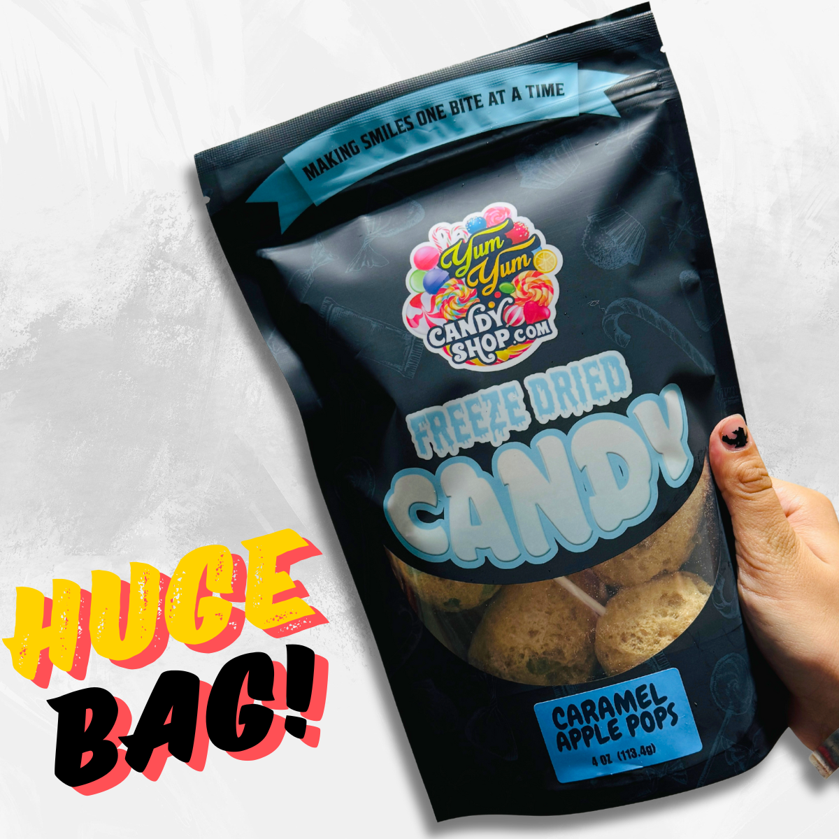 Large bag of freeze dried caramel apple pops being held in hand