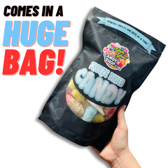 Large bag of freeze dried gummies candy being held in hand