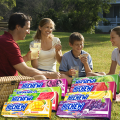 Family enjoying Hi-Chew chewy fruit candy at picnic