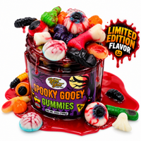 Jar of Spooky sticky gooey gummies limited edition overflowing with Halloween eyeball, bone, and bat shaped gummies in red sauce on a white background