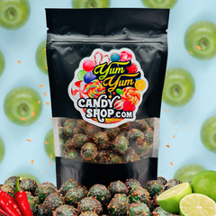 Chamoy Green Apple Sours 8oz bag with fresh green apples, limes, and chili peppers in background.