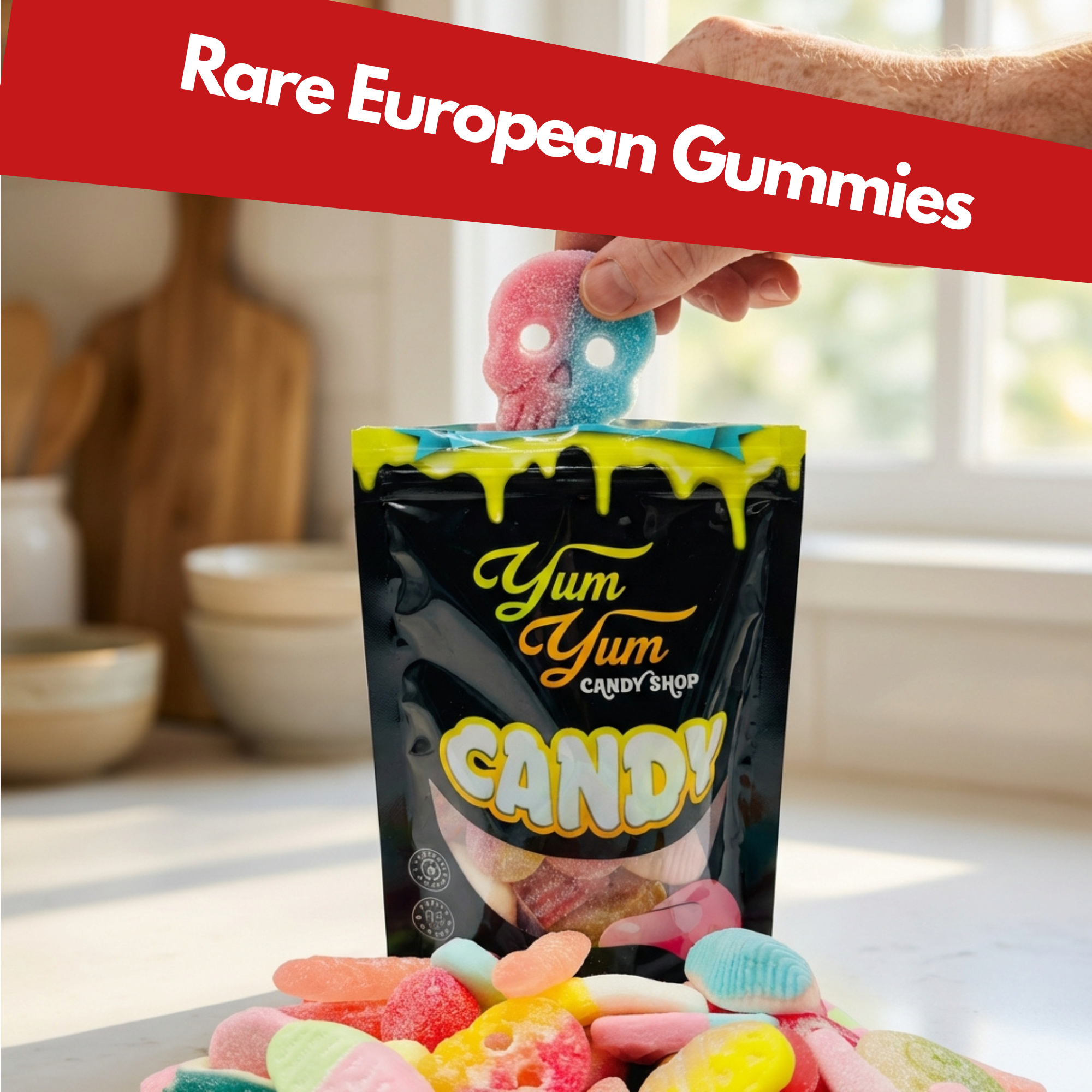 Hand holding a European gummy candy above Yum Yum Candy Shop bag with assorted gummies