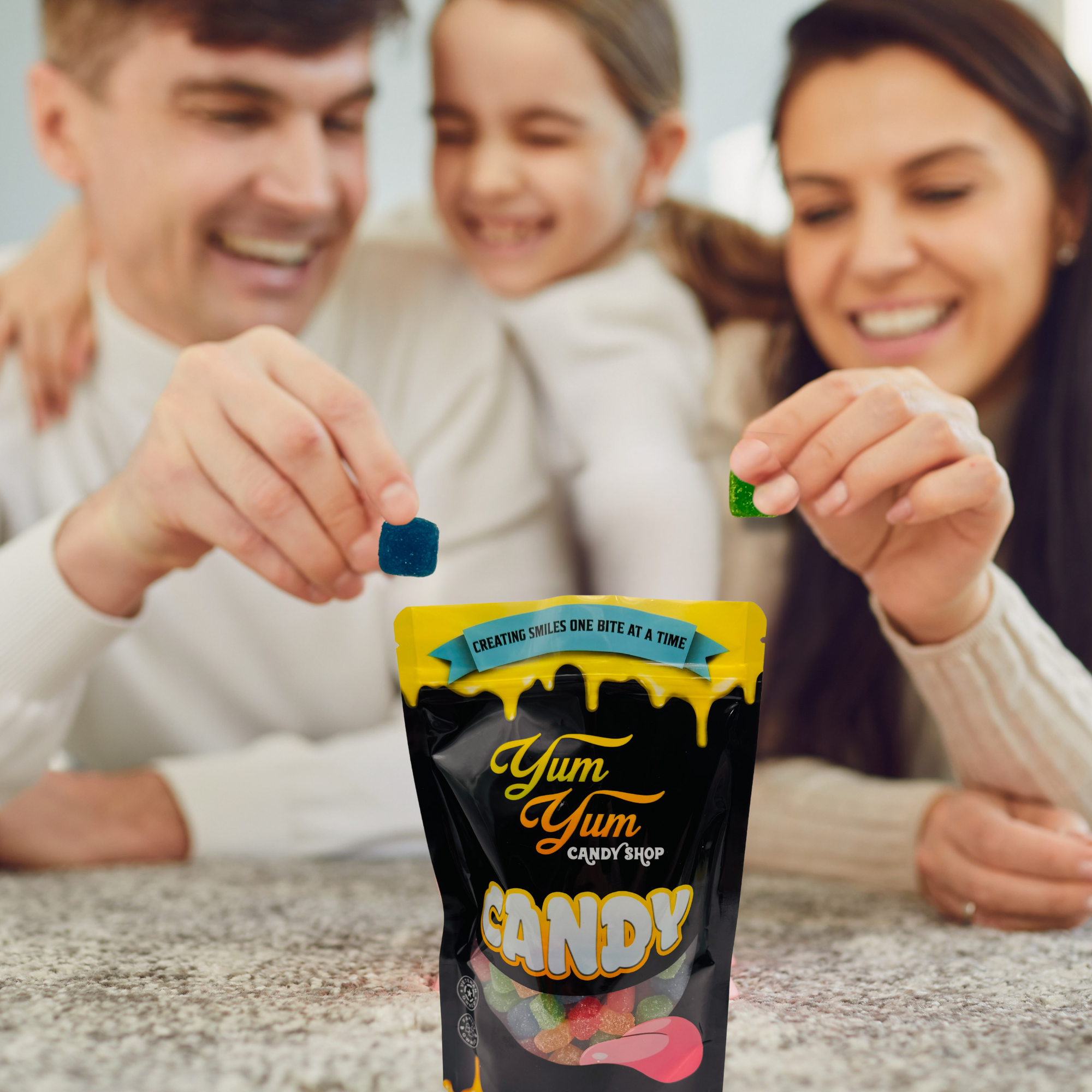 Family enjoying Yum Yum Candy Shop Extreme Sour Gummy Cubes together