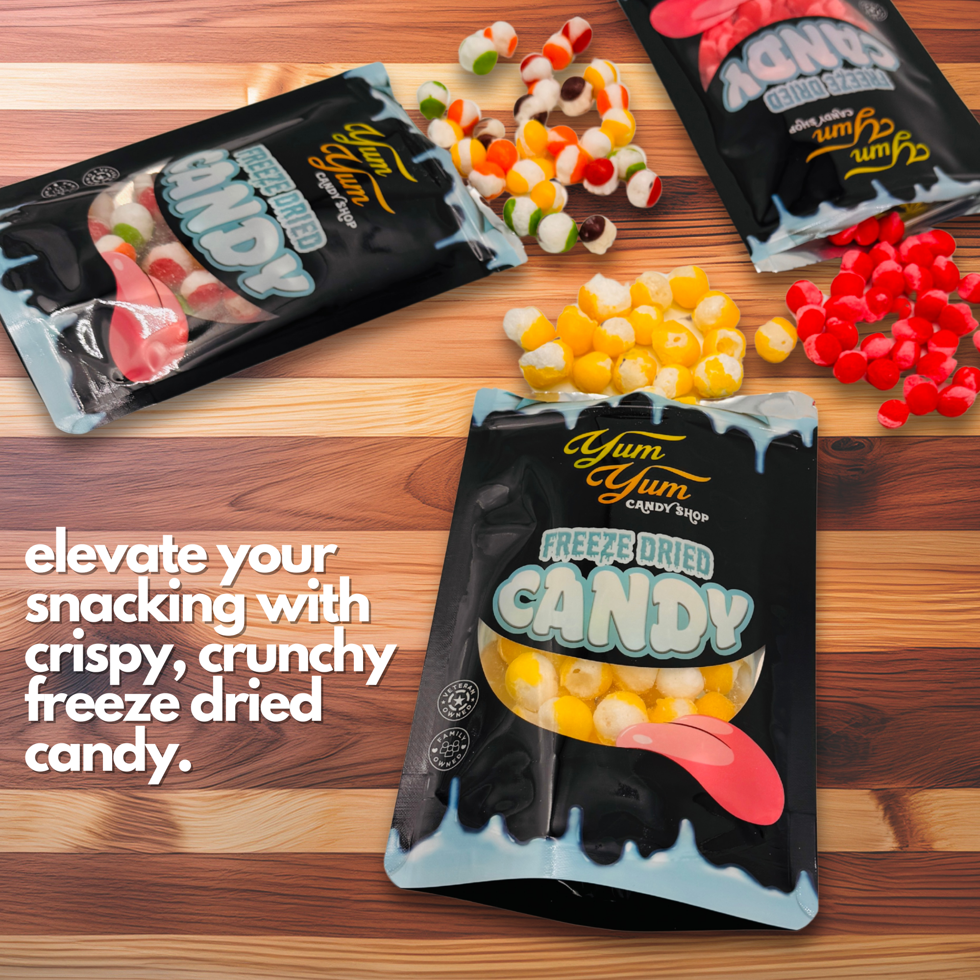 Assorted Yum Yum Candy Shop freeze dried candy bags with colorful crunchy candies on wooden surface