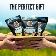 Freeze-Dried Candy Trio Pack in gift box labeled “The Perfect Gift” held outdoors.