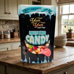 Yum Yum Candy Shop freeze-dried candy package on a wooden table in a kitchen.