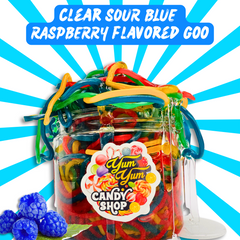 Jar of colorful candy labeled 'Yum Yum Candy Shop' with blue raspberry flavor text on a blue and white background.