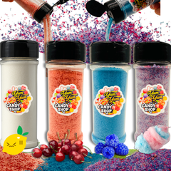 Four containers of colorful candy powder with 'Yum Yum Candy Shop' labels, surrounded by candy and sprinkles.