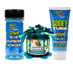 Yum Yum Delights blue raspberry products including powder, gummies, and liquid candy on a white background.