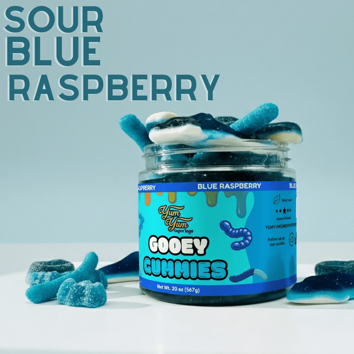 Jar of sour blue raspberry gummies with a blue label on a light blue background