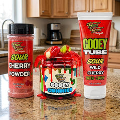 Three  sour wild cherry candy products from Yum Yum Delights on a kitchen counter.