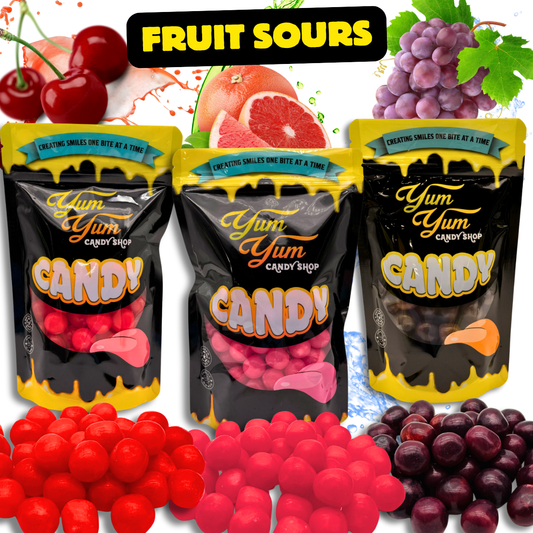 Three bags of Yum Yum Candy Sours in Cherry, Grape, and Grapefruit flavors with fruits and the candy pieces visible.