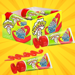 Warheads sour squeeze candy with retail packaging on yellow background
