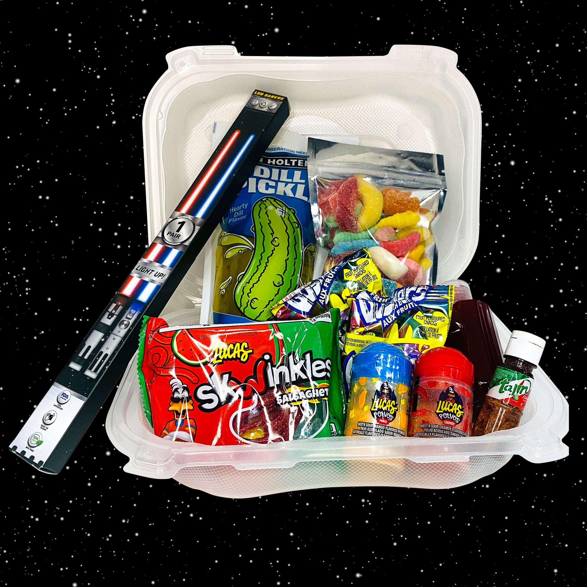 Black stars in the background and a chamoy pickle kit with chop saber chop sticks