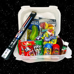 Black stars in the background and a chamoy pickle kit with chop saber chop sticks